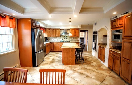 Benton Harbor Casa | Colonial style 5BR/5BA home tucked in a private, wooded setting w/pool & hot tub