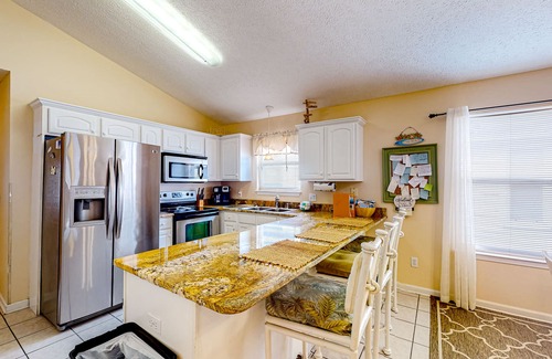 Panama City Beach Cabaña | Colorful home near the beach with 2 pools, bikes, beach gear, W/D, & AC