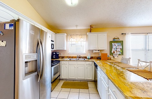 Panama City Beach Cabaña | Colorful home near the beach with 2 pools, bikes, beach gear, W/D, & AC
