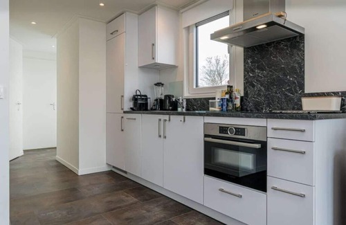 Burgh-Haamstede Casa | Comfortable 4-person chalet with living room with sofa and 2 lovely armchairs, air conditioning, 2 b