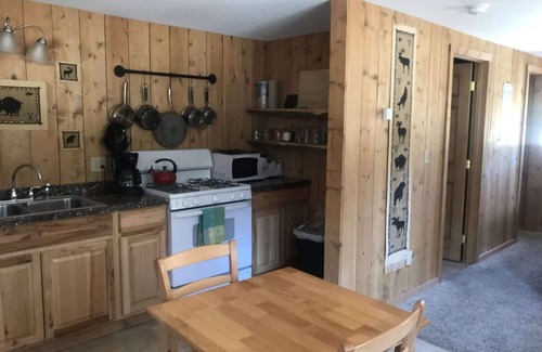 Cooke City-Silver Gate Cabina | Comfy cabin is situated on the Silver Gate property which overlooks 10,000ft tall mountain peaks surrounding the town.