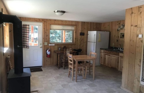 Cooke City-Silver Gate Cabina | Comfy cabin is situated on the Silver Gate property which overlooks 10,000ft tall mountain peaks surrounding the town.