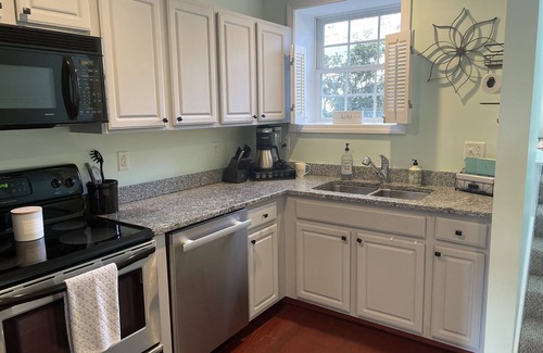 Laconia Condominio | Comfy lake condo, great location to swim, boat, hike, ski & more!