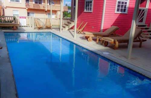 Cayo Corker Cabaña | Coral Cottage en Low Caye Cottages 1 de 4 grandes cabañas