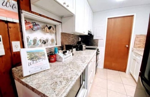 Vacation Village Casa | Coral Cottage-Pvt lake & pool access Near theme parks w/porch