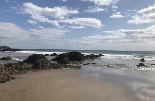 Widegates Casa | Corn Barn at East Trenean Farm -Luxury Cornish Barn Conversion sleeping 8 with hot tub, private garden, rural views and EV facilities