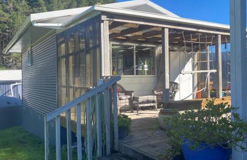 Kawhia Casa | Cosy Aotea Harbour Cottage - water views