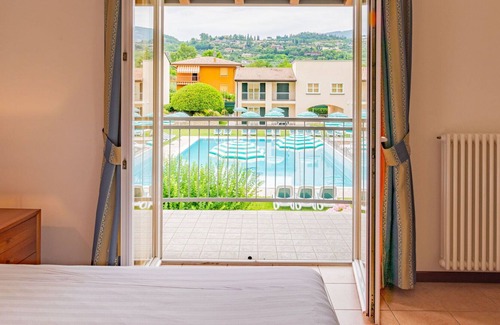 Garda Apartamento | Cosy apartment for 4 people with pool, WIFI, A/C, TV, patio and parking