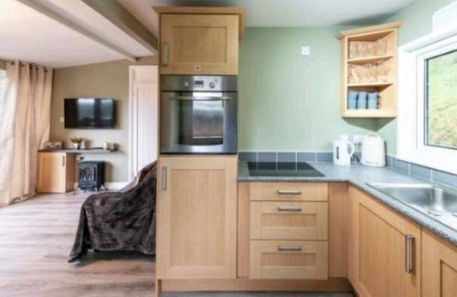 Bont Newydd Cabina | Cosy cabin on a quiet family run site