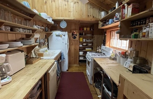 Standish Cabaña | Cottage nestled in the woods overlooking Sebago Lake.
