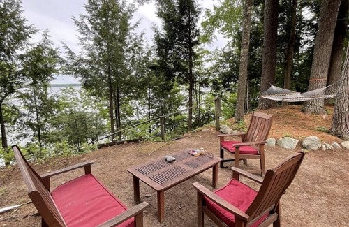 Standish Cabaña | Cottage nestled in the woods overlooking Sebago Lake.