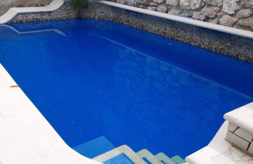 Independencia Apartamento | Cozumel peaceful retreat, WIFI, pool TV, Kitchenet, walking distance to town.