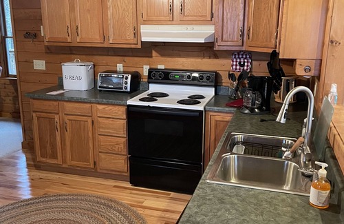 Tuckasegee Casa | Cozy, 4 front porch rocking chairs, porch swing, picnic shelter, outdoor fire.