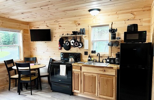 Sangerville Cabina | Cozy cabin located on the Atv & snowmobile trail. Family & Pet Friendly