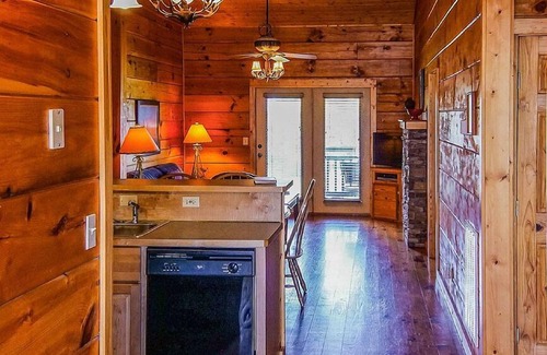 Spencer Cabina | Cozy cabin with fire pit, hot tub, and pool, and a swing set in the backyard!