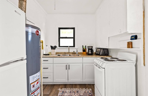 North End Cabaña | Cozy cottage in North End on tree-lined street.