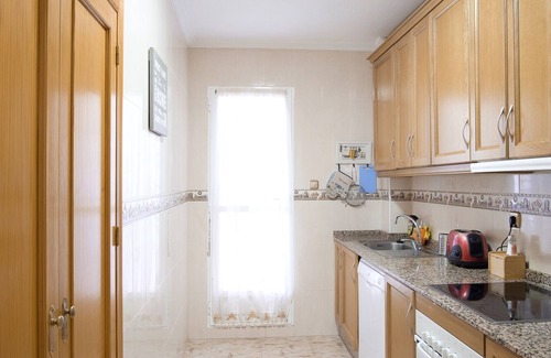 La Marina Apartamento | Acogedor apartamento familiar con patio y terraza y piscina comunitaria