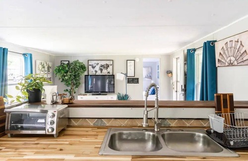Danville Casa | Cozy home with butcher block counter tops, custom live-edge walnut bar top