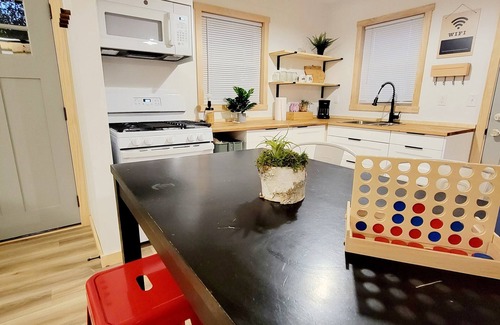 Des Moines Casa | Cozy Iowa Fairgrounds Bungalow. Vintage Camper. Game Shed. Large Fenced Yard!