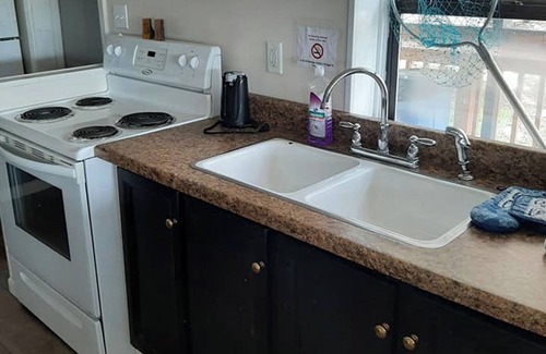 Camden Casa | Cozy Lakeview Cabin 12 for Large Groups Within a Marina