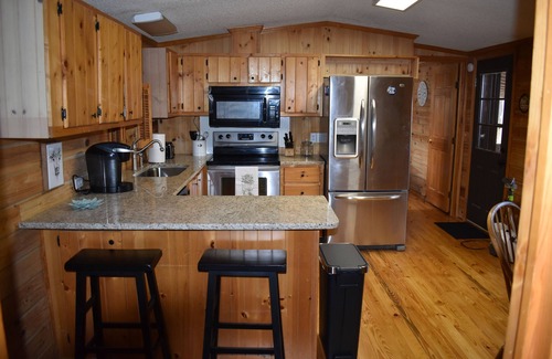Lowesville Casa | Cozy log cabin, centrally located with covered storage for an RV/Boat