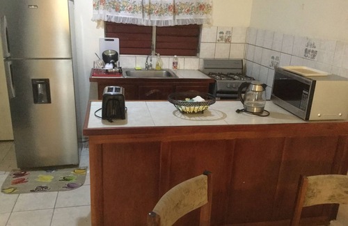 Molynes Gardens Casa | Acogedora casa de pueblo con dos dormitorios con capacidad para un máximo de cuatro personas.