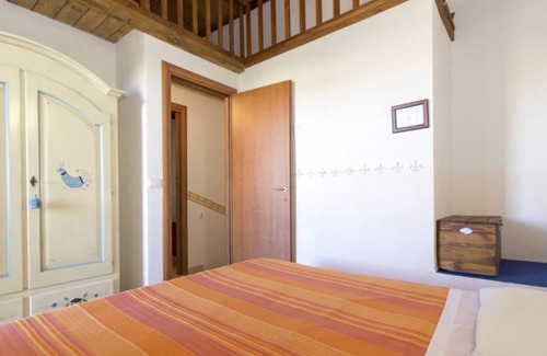 Pirotto Li Frati Apartamento | Acogedora casa de campo de dos plantas para 4 personas a 600 m a pie del mar.