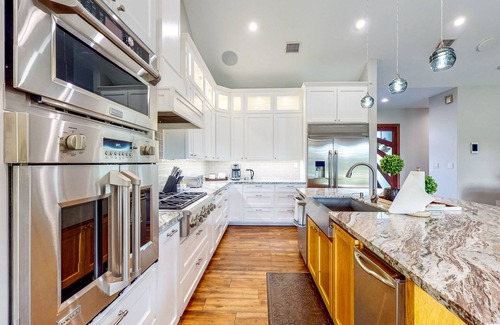 Waller Casa | Custom home with guesthouse, pond, sunning deck, beach & tropical bar
