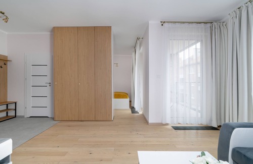 Stare Miasto District Apartamento | Dark Grey and Pink Apartment by Renters