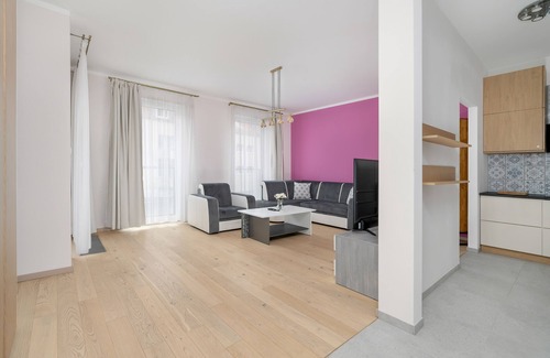 Stare Miasto District Apartamento | Dark Grey and Pink Apartment by Renters