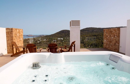 Cala Vadella Villa | Delightful Ibiza Apartment | Apartment Henry | 4 Bedrooms | Panoramic Sea Views | Private Jetted Tub & Shared Pool | Cala Vadella
