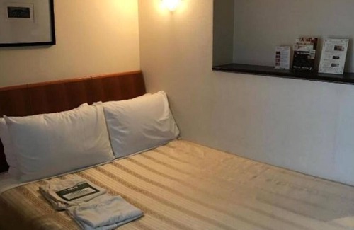 Matsuyama Hotel | Deluxe double Smoking Corner room With massage / Naha Okinawa