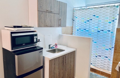 Islote Apartamento | Discovery Inn Suites at 681 Ocean Drive