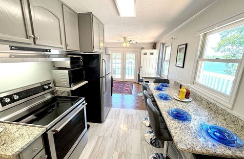 North Shore Casa | Dock Days- Deep water and fantastic wide water views. Volley Ball and horseshoe competitions await.