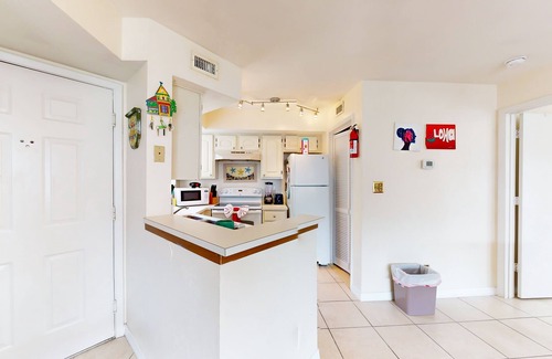 Ocean Side Village Condominio | Dog-friendly condo near the beach with outdoor pool, hot tub, gym, balcony, W/D
