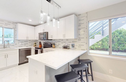 Isles of Capri Casa | Dog-friendly duplex with a patio, deck, washers, dryers, & central AC