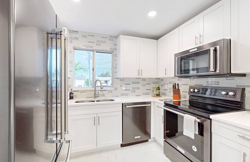 Isles of Capri Casa | Dog-friendly duplex with a patio, deck, washers, dryers, & central AC