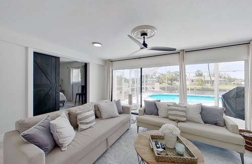 Fort Myers Casa | Dog-friendly home with private pool, dock, fireplace, patio, grill, & canal view
