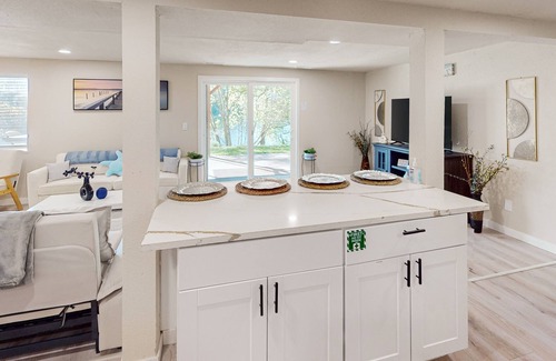 Shoreline Casa | Dog-friendly lake view home with kitchen & kitchenette, patio, sunroom