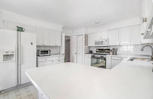 Arcadia Casa | Dog-friendly, lake view home with three season room, fireplace, video projector
