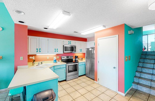 East End Casa | Dog-friendly, poolside townhouse w/community pool, grills, deck, beach gear, AC
