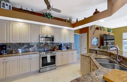 Matlacha Isles Casa | Dog-friendly waterfront home with heated pool, lanai, central AC, & W/D