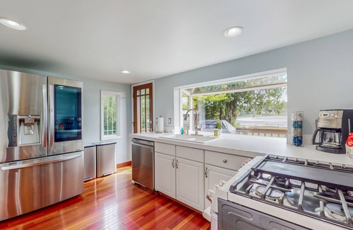 Burley Casa | Dreamy waterfront haven with beach, pond, trails, kayaks, hot tub & shuffleboard