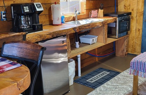 Hot Springs Cabina | Eagle's Nest Cabin / Sibley4 Tent combo @EvansCliff hot tub canyon views