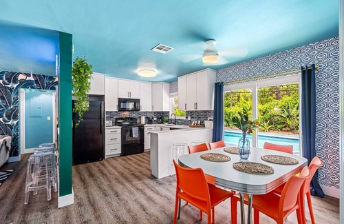Garden Isles Casa | Eccentric home with pool, tiki hut & outdoor kitchen