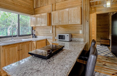 Tulum Cabina | Eco-luxe jungle cabin with furnished patio, lanai, partial AC, & on-site cafe
