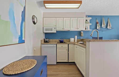 Charlevoix Condominio | Edgewater Inn Condo #117D with Waterfront Access | Pool, Hot Tub, Sauna