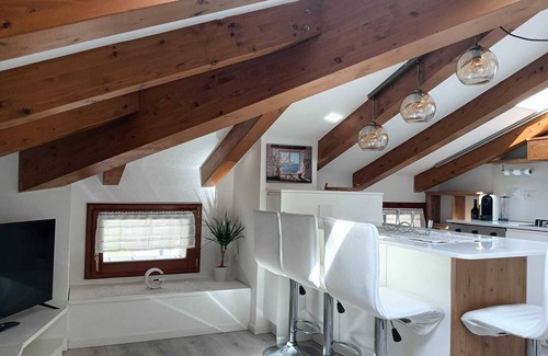Levico Terme Apartamento | Elegant attic with Dolomites view, relaxation and nature in Levico Terme.