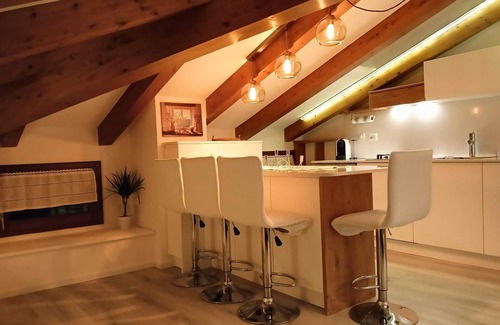 Levico Terme Apartamento | Elegant attic with Dolomites view, relaxation and nature in Levico Terme.