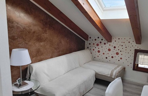 Levico Terme Apartamento | Elegant attic with Dolomites view, relaxation and nature in Levico Terme.